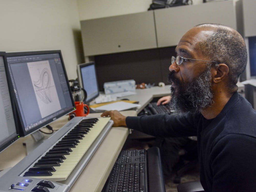 Christopher Goodbeer, a braille transcriber working in the wells library, transcribe  braille information of calculus Monday morning at the Wells library. Goodbeer has been a Braille Transcriber for nine years. 