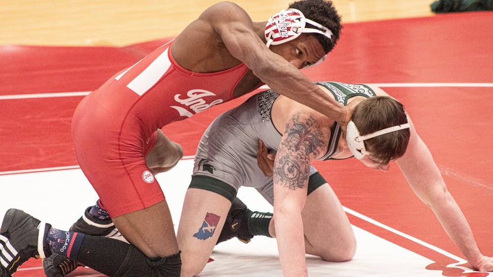 IU sophomore DJ Washington and Michigan State senior Drew Hughes face off during their match on Feb. 6, 2021, at Wilkinson Hall in Bloomington. Indiana won both of its tri-dual matches 40-3.