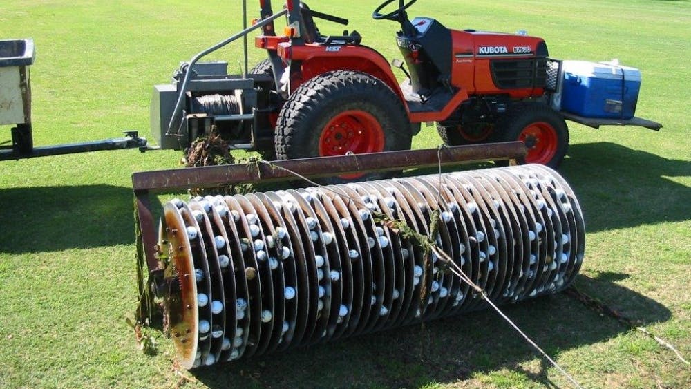 Rawhide Golf Ball Co. collects golf balls lost at the bottom of ponds and resells them. Rollers are connected to tractors to collect submerged balls.