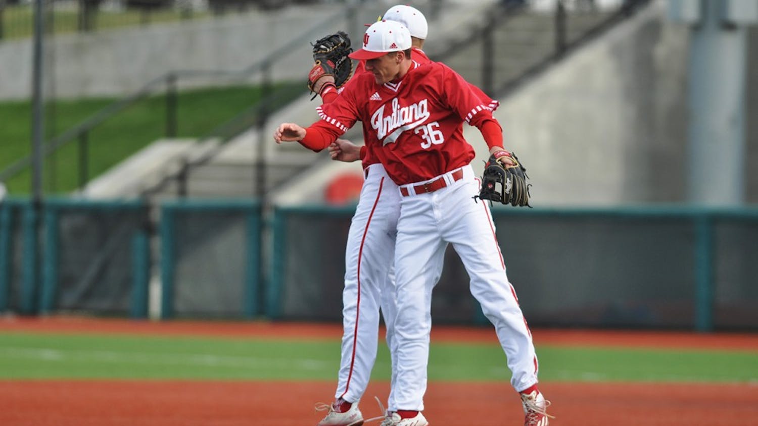Junior Colby Stretten and freshman Matt Gorski celebrate the Hoosiers’ 12-1 victory over Middle Tennessee on Saturday at Bart Kaufman Field.
