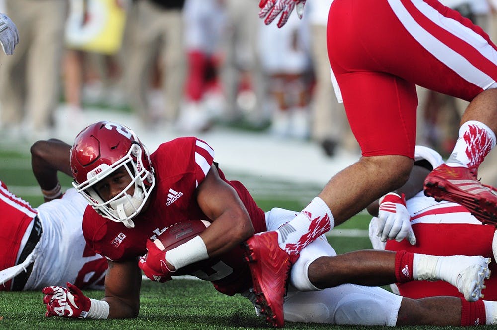 Redshirt freshman Devonte Williams gets up from a tackle in the second quarter at Memorial Stadium on Saturday. IU lost to Nebraska 27-22.