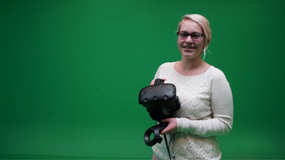 Senior Catherine Onofrey poses with an HTC Vive virtual reality headset. With help from the Mark Cuban Center for Sports Media and Technology, Onofrey developed a virtual reality basketball video game that takes place inside Simon Skjodt Assembly Hall on Branch McCracken Court.