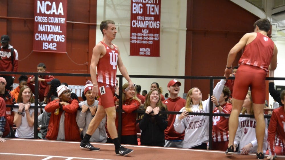 Kyle Mau and Daniel Michalski celebrate with teammates after the men’s distance medley Jan. 25 at the IU Relays at Gladstein Fieldhouse. Mau now holds the NCAA's fastest time this season in the men’s mile.