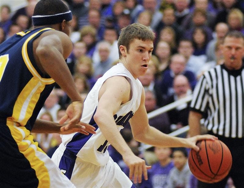 Bloomington South senior guard Jordan Hulls drives past a Detroit Country Day defender during a game on Feb. 21 in Bloomington. Hulls is an IU commit.