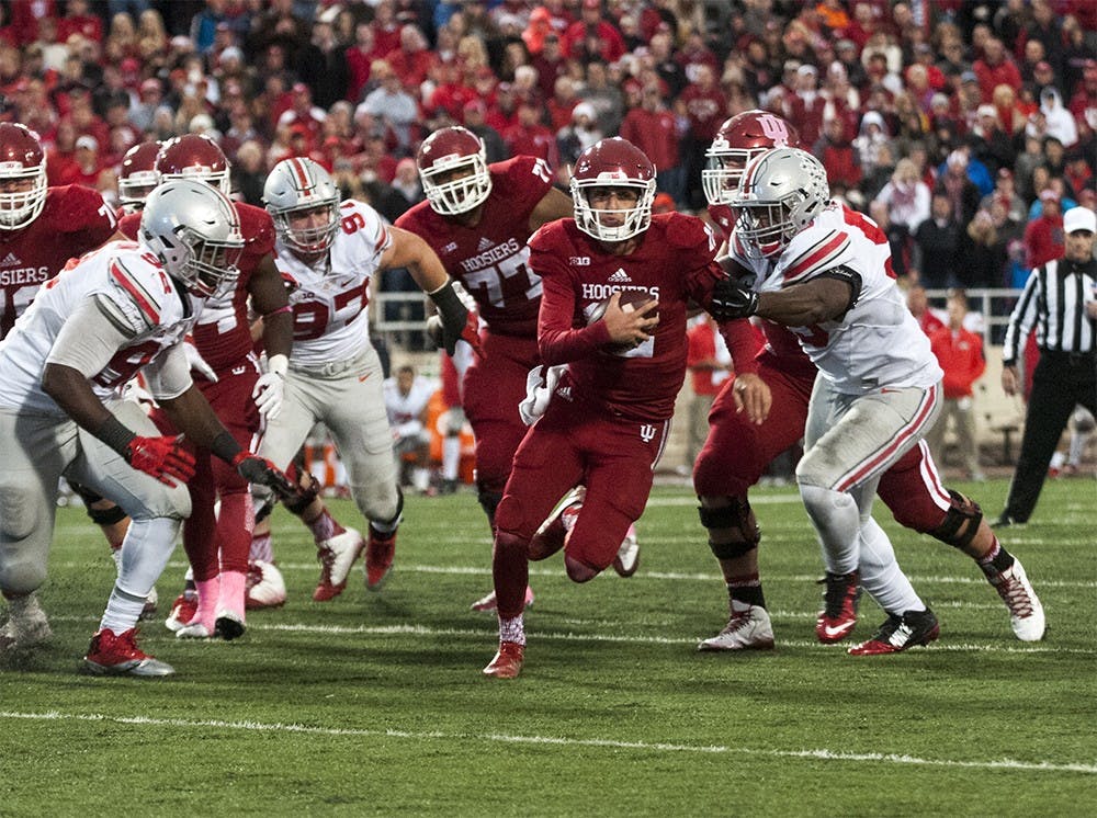 Quarterback Zander Diamont runs out of the pocket during the game against Ohio State on Saturday at Memorial Stadium. The Hoosiers lost to the number one ranked Buckeyes, 27-34.