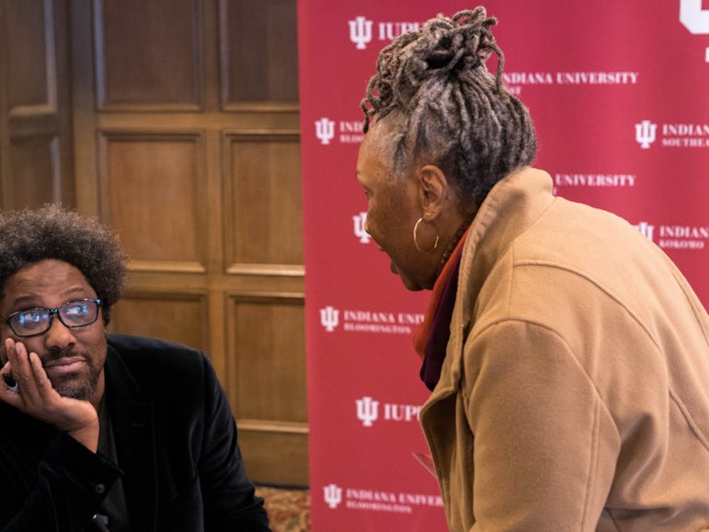 CNN host W. Kamau Bell talks with a woman who came to hear him speak Jan. 15 at the Indiana Memorial Union. Bell spoke in honor of Martin Luther King Jr. and offered commentary on racism and whiteness in American society.&nbsp;
