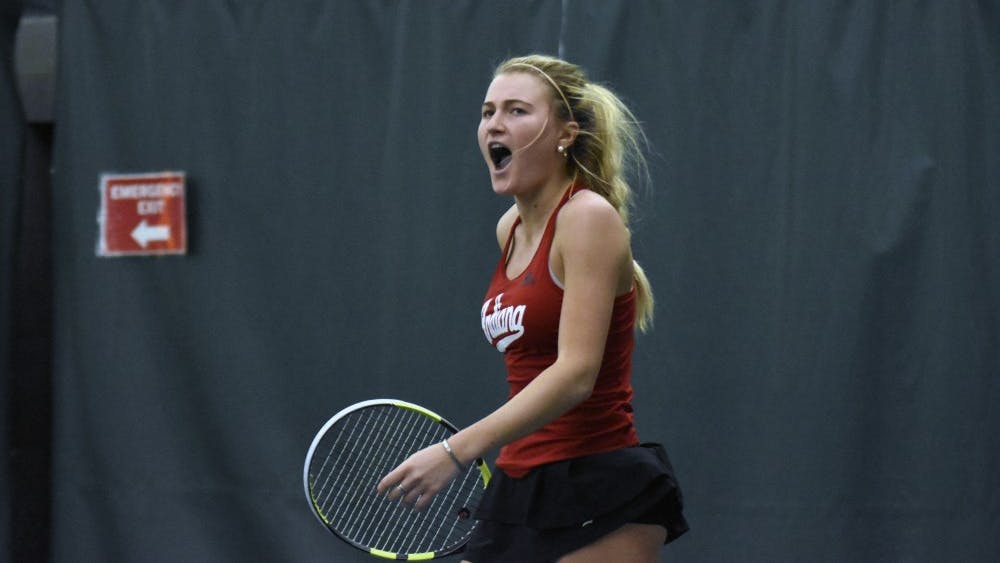 Junior Madison Appel celebrates after winning a point during her 7-6, 6-1 singles win over Minnesota. The Hoosiers improved to 13-6 on the season after their 5-2 win over the Golden Gophers.