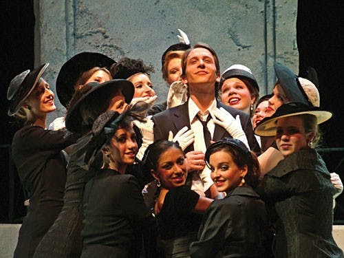 Courtesy PhotoJohn R. Armstrong as Guido is surrounded by women during the Department of Theatre and Drama's prduction of "Nine, the Musical" at the Ruth N. Halls Theatre.
