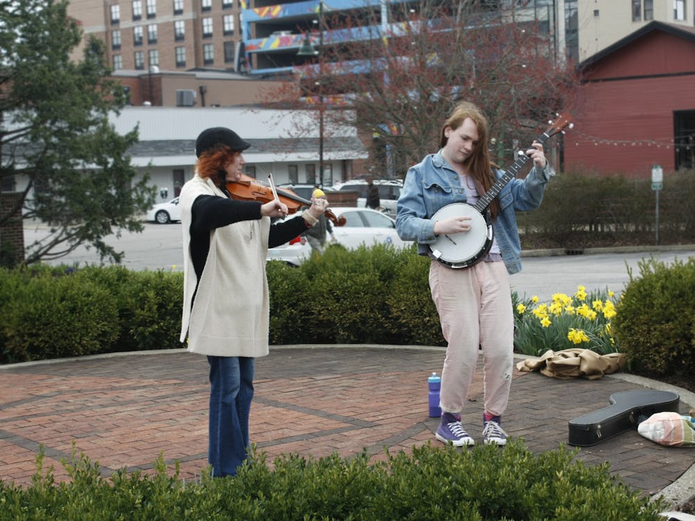 Andrea Mcfarland and Rose Regina are seen on April 2, 2022 at the Bloomington Community Farmers&#x27; Market. Regina also accompanied the duo by singing along. 