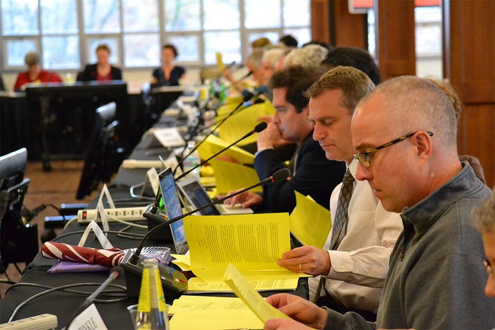 Members of the Bloomington Faculty Council (BFC) discuss the proposed policy of IUPD having the ability to enter sorority and fraternity houses without notice or consent during the BFC meeting Wednesday afternoon in the IMU Solarium.