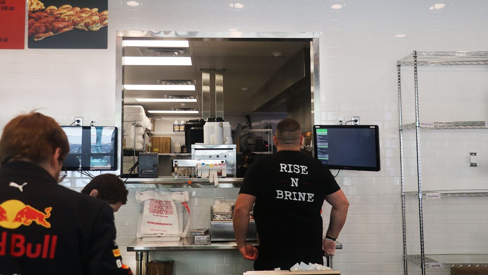 The staff of Dave&#x27;s Hot Chicken prepare food orders for its lunch time rush. The menu includes a variety of options for its customers including sliders, sandwiches or chicken served on its own. 