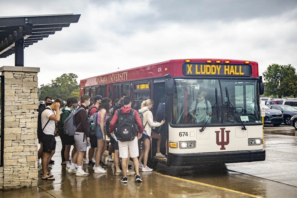 <p>Students board the X Route bus Aug. 30, 2021, at Memorial Stadium. Students have  experienced extended bus delays on the campus bus service this semester.</p>