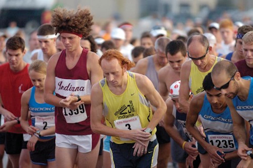 IDS FILE PHOTORunners at the 2007 IU Mini-Marathon start their watches and step into their first stride as the race begins.
