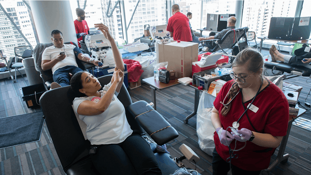 Phlebotomist Korey Dyerly, right, puts a &quot;blue tag&quot; on blood donated by Antonia Warren on April 2, 2019, during a Red Cross blood drive at Lurie Children&#x27;s Hospital in Chicago. According to an American Red Cross statement in June, a rise in trauma cases, organ transplants and elective surgeries depleted the nation’s blood inventory.