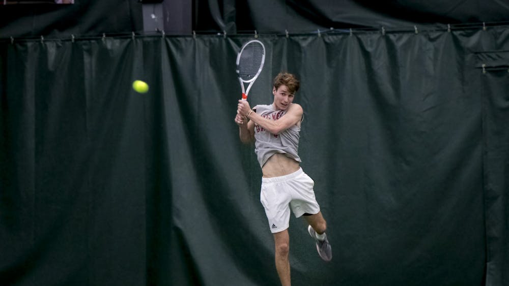 IU senior Bennett Crane leaps for the ball in a match against the University of Memphis on Jan. 17 at the IU Tennis Center. Crane is the highest ranked Hoosier since Sam Monette in 2016, who opened the season at No. 27.