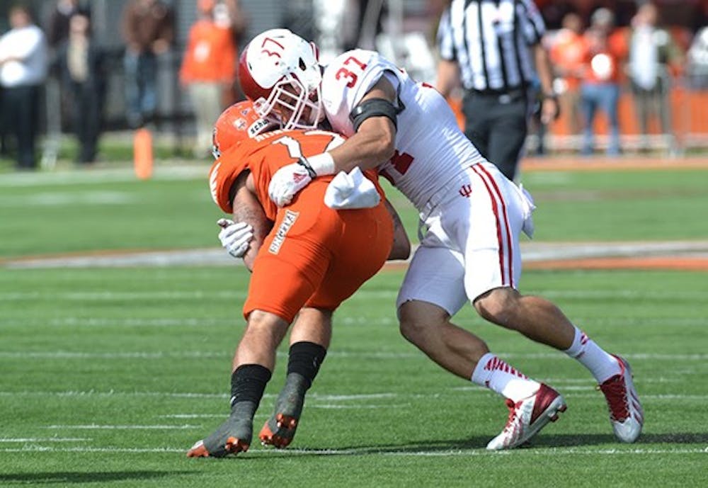Senior Mark Murphy makes a tackle during IU's game against Bowling Green on Saturday at Doyt Perry Stadium.