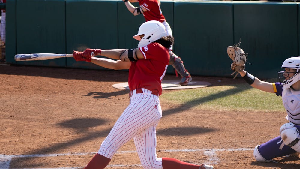 Junior catcher Desiree Dufek hits the ball against Western Illinois University on March 5, 2022. Indiana is 1-5 against teams ranked in the top 25 in the country.