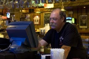 Bob "Hebe" Hebenstreit tends bar at Nick's English Hut on Aug. 20.
