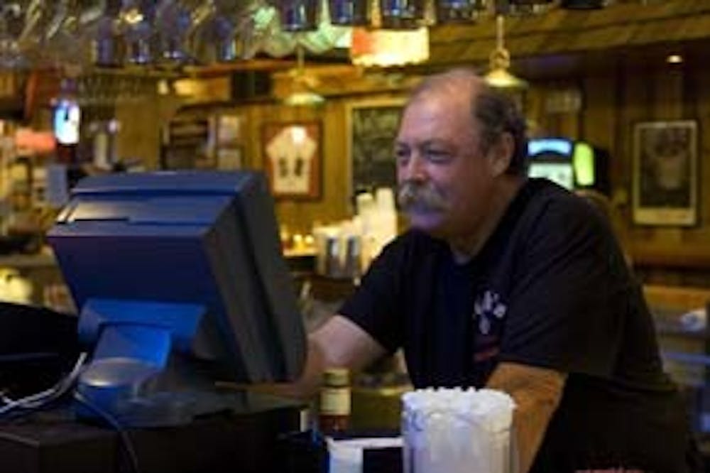Bob "Hebe" Hebenstreit tends bar at Nick's English Hut on Aug. 20.