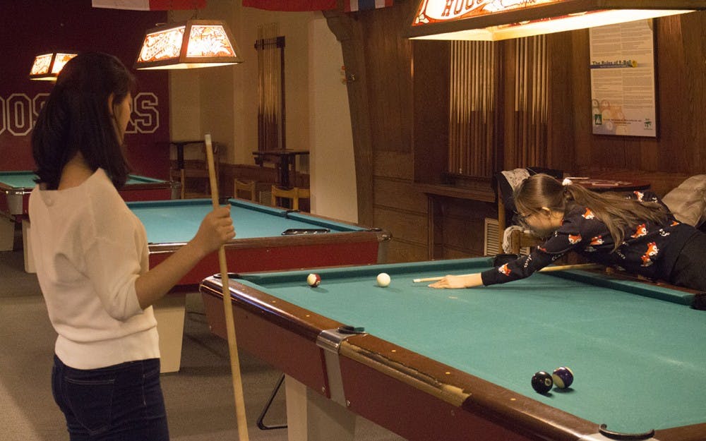 Hui Lin and Linlin Sun spent their time between classes the first day of the semester hanging out together and playing pool in the Indiana Memorial Union.