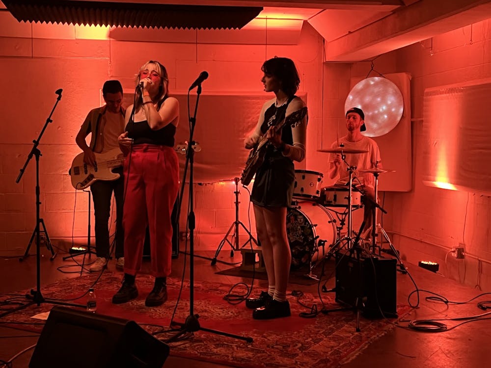 The band SYZYGY performs April 14, 2022, at Blockhouse Bar. Lu Harper, lead vocalist and IU freshman, started the band in August 2021, but the full band officially formed about a week ago as they met Cory Schmitt, drummer and IU sophomore, through Music Industry Creatives on campus. 