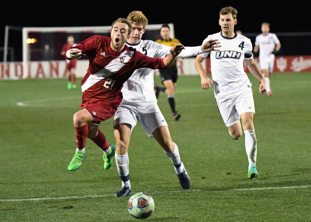 Redshirt freshman defender Spencer Glass is fouled by New Hampshire in the third round of the NCAA tournament Saturday evening at Bill Armstrong Stadium. Junior midfielder Francesco Moore made a penalty kick after the foul to score IU's second goal in their 2-1 win against New Hampshire.