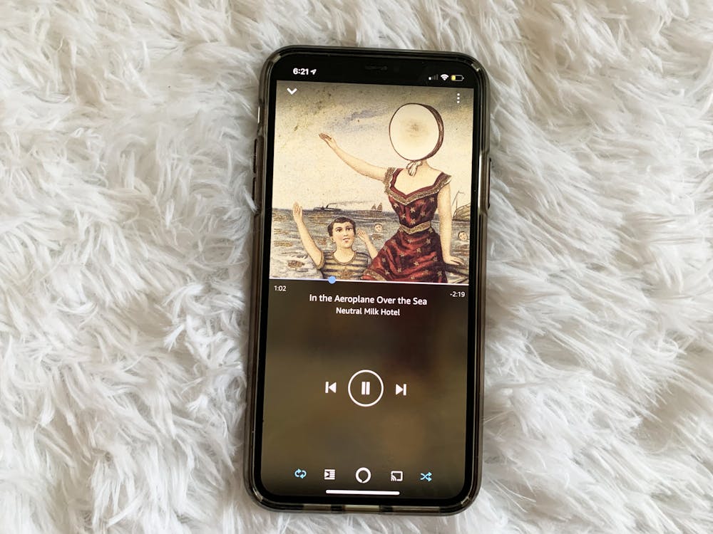 <p>An iPhone is pictured showing the song “In the Aeroplane Over the Sea” by Neutral Milk Hotel. </p>