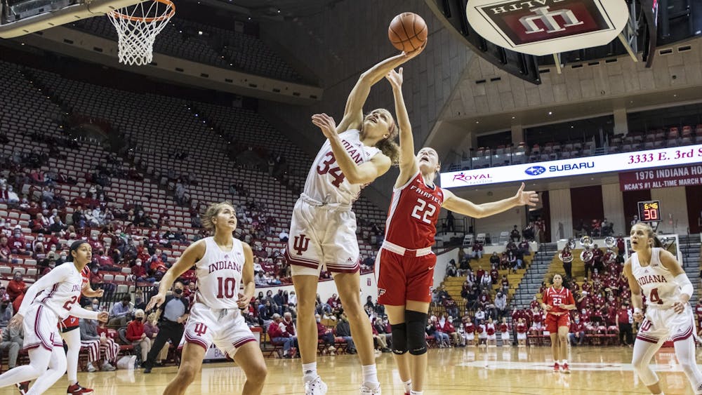 Senior guard Grace Berger attempts to rebound the ball Dec. 9, 2021, at Simon Skjodt Assembly Hall. Indiana&#x27;s next game is scheduled for Thursday against Illinois.