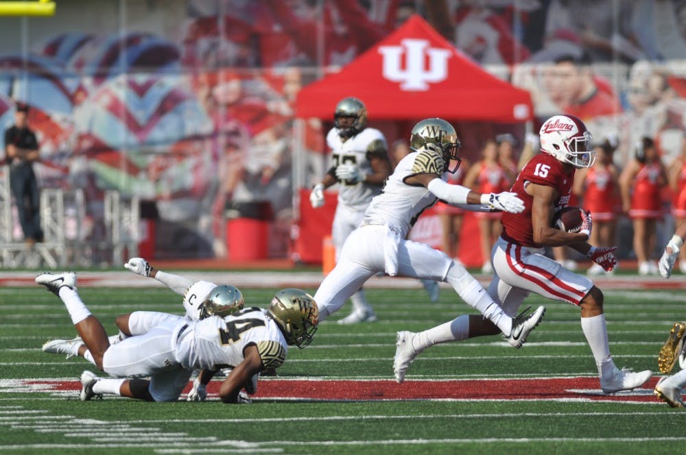 Sophomore Nick Westbrook evades three Wake Forest defenders to catch a pass in the second quarter on Saturday at Memorial Stadium. IU lost 33-29