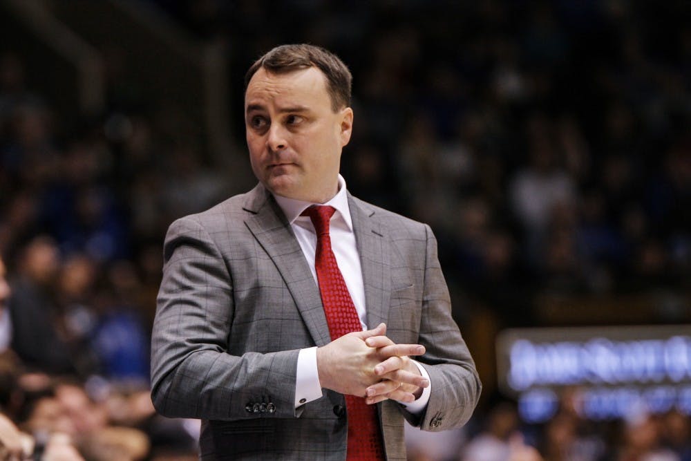 Archie Miller talks to assistant coach 