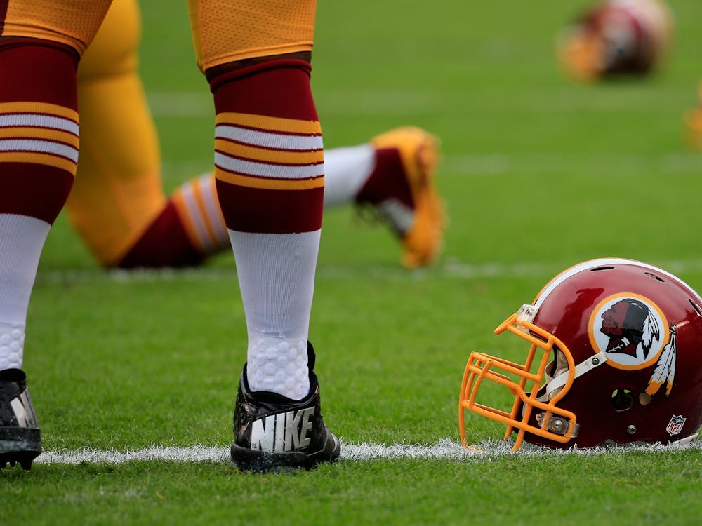  A Washington Redskins helmet is seen in 2014 on the field before a game.