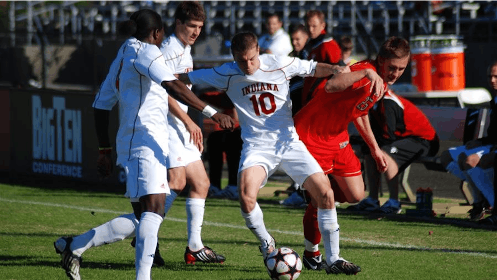 Junior midfielder Andy Adlard and Ohio State's Konrad Warzycha fight for control of the ball in front of the Hoosier bench Nov. 1 at Bill Armstrong Stadium. The Hoosiers play their first game of the Big 10 tournament today at 12:30 p.m. against Wisconsin. The winner of that game plays Ohio State in the second round.