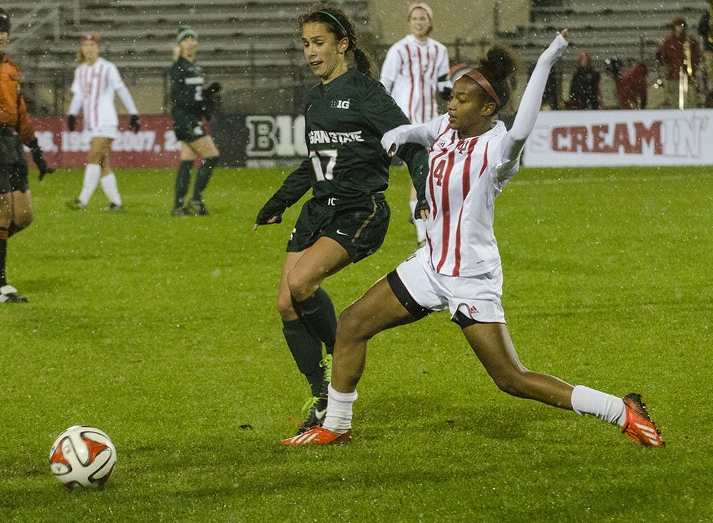 Freshman defender Mykayla Brown breaks up a pass intended for Michigan State midfielder Sarah Kovan during the Hoosier's final game of the season friday night. IU won 2-0 and finsihed its season 7-11-1.