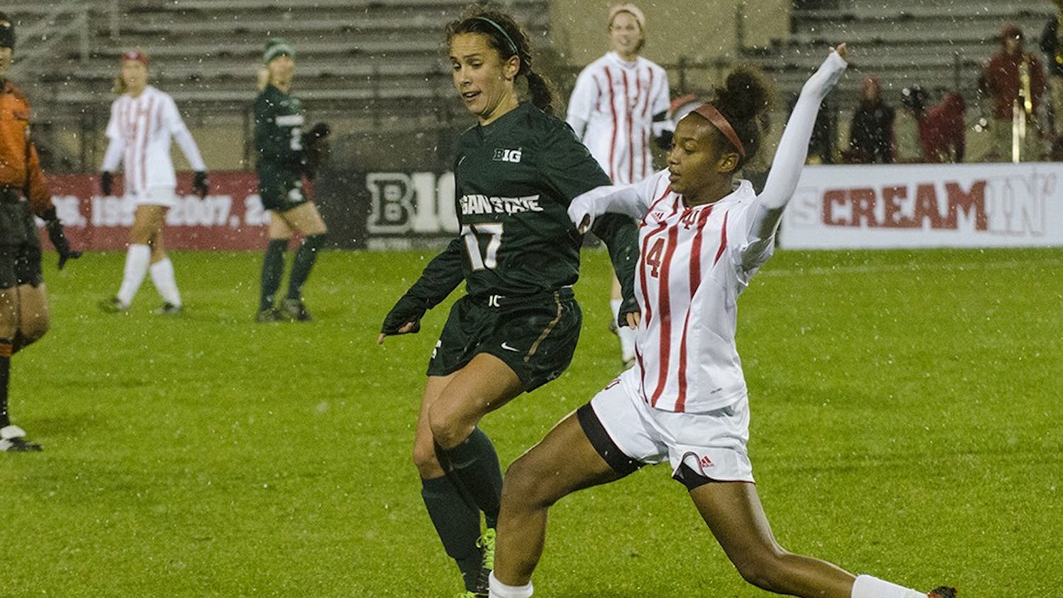 Freshman defender Mykayla Brown breaks up a pass intended for Michigan State midfielder Sarah Kovan during the Hoosier's final game of the season friday night. IU won 2-0 and finsihed its season 7-11-1.
