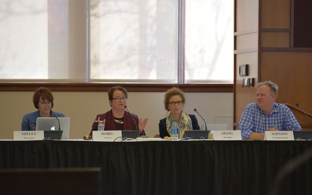 Provost Lauren Robel discusses the Officer's Report with the other BFC members. 