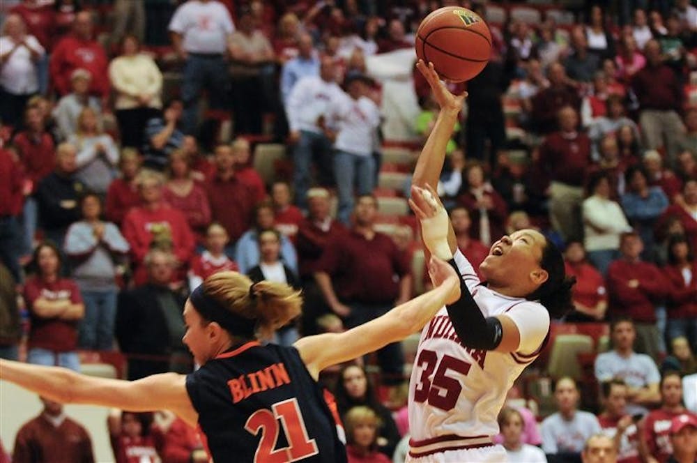 Illinois guard Macie Blinn fouls IU guard Kim Roberson during the second half of IU's 66-59 loss Feb. 8 at Assembly Hall. Roberson had 11 points and nine rebounds.