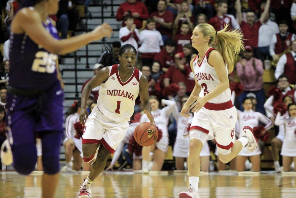 <p>Freshman guard Bendu Yeaney runs alongside senior Tyra Buss. The Hoosiers defeated the TCU Horned Frogs, 71-58, Thursday at Simon Skjodt Assembly Hall during the WNIT semifinals.&nbsp;</p>