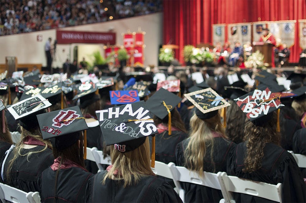 Graduates wear decorative square academic caps during the commencement ceremony on May 10 2014 at Assembly Hall.