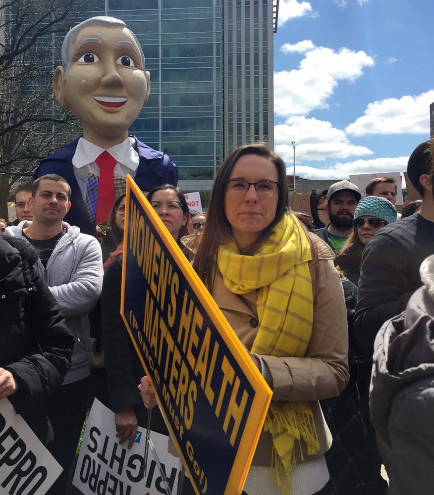 Many protesters brought signs criticizing Governor Mike Pence. A towering Pence dummy in the audience held a sign that read, "I'm Mikey and I hate everyone."