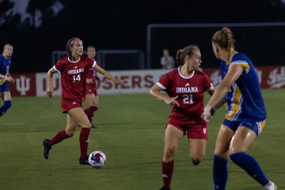 Sophomore midfielder Olivia Smith dribbles through defenders against Morehead State Aug. 24, 2023, at Bill Armstrong Stadium. Indiana defeated Morehead State 3-0.