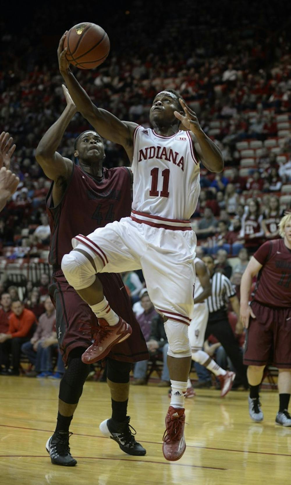 Junior guard Kevin Yogi Ferrell takes a shot during the exhibition game against Indianapolis on Monday at Assembly Hall.