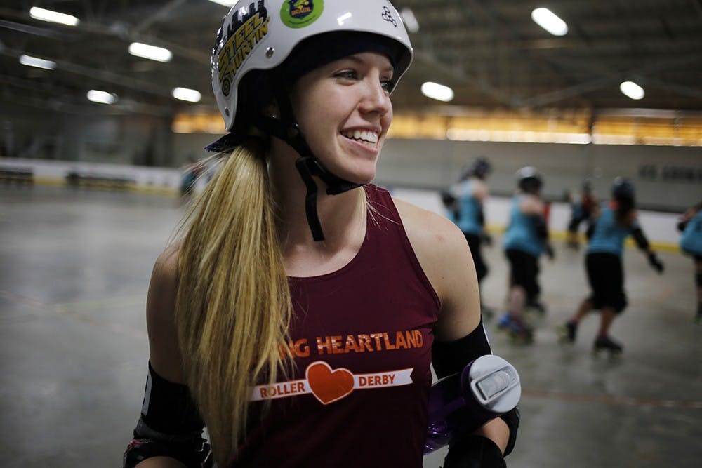 Becca Twait, a sophomore at IU, has been playing as a jammer on the Bleeding Heartland Roller Derby team in Bloomington since she joined the team in October. As the jammer, Becca scores points for her team by skating around the track and lapping members of the opposing team. "I like hitting people and going fast," said Twait. "Going fast is what I'm best at."