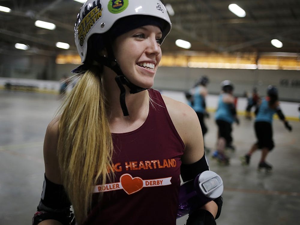 Becca Twait, a sophomore at IU, has been playing as a jammer on the Bleeding Heartland Roller Derby team in Bloomington since she joined the team in October. As the jammer, Becca scores points for her team by skating around the track and lapping members of the opposing team. "I like hitting people and going fast," said Twait. "Going fast is what I'm best at."