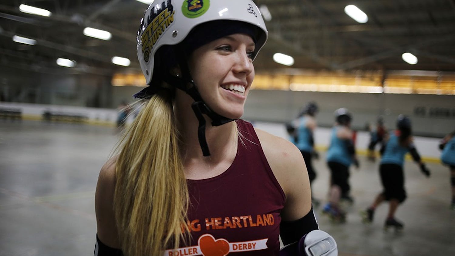 Becca Twait, a sophomore at IU, has been playing as a jammer on the Bleeding Heartland Roller Derby team in Bloomington since she joined the team in October. As the jammer, Becca scores points for her team by skating around the track and lapping members of the opposing team. "I like hitting people and going fast," said Twait. "Going fast is what I'm best at."