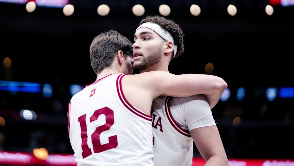 Graduate senior forward Miller Kopp celebrates with graduate senior forward Race Thompson after the game on March 10, 2023, at the United Center in Chicago. Indiana defeated Maryland 70-60.