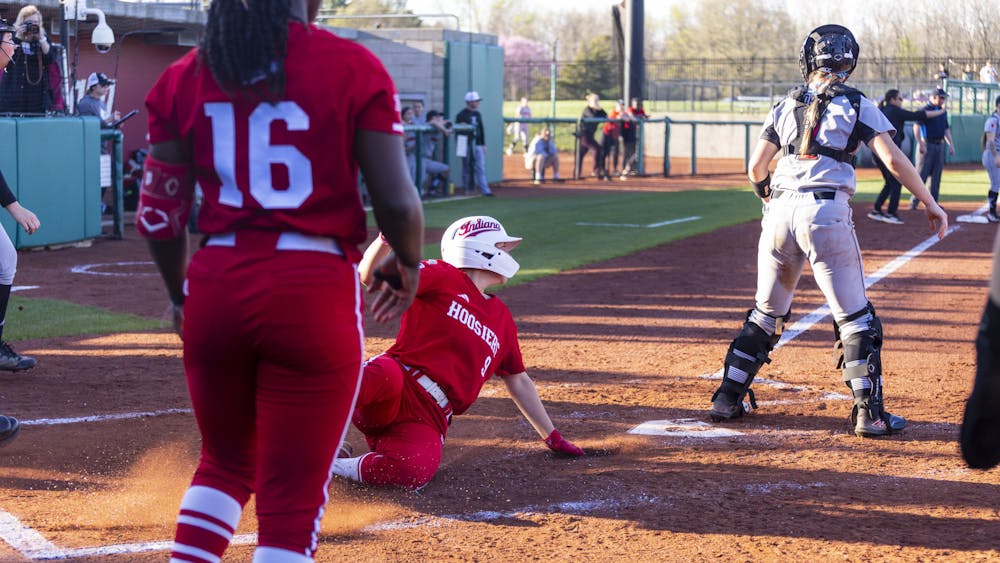Freshman Taryn Kern slides into home plate for a run on April 11, 2023, at Andy Mohr Field. The Hoosier beat Louisville 10-5.