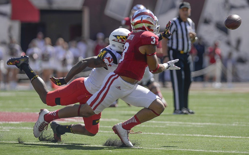 Freshman receiver Dominique Booth tries to catch a pass during IU's game against Maryland on Sept. 27 at Memorial Stadium.