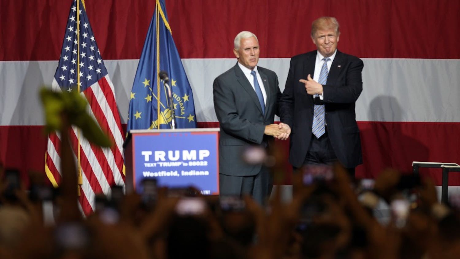 Governor Mike Pence and Republican Presidential Candidate Donald Trump address the crowd after Pence introuces Trump to the stage during a Trump rally in Westfield, Ind. on Tuesday evening.