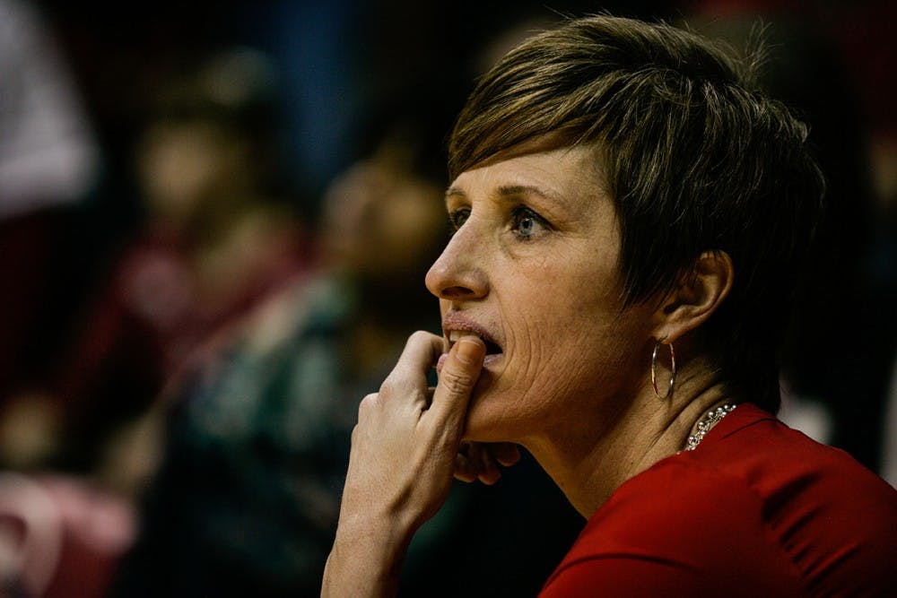 Head coach Teri Moren takes a knee at the edge of the court during the fourth quarter of play. The Hoosiers held on late to beat the Iowa Hawkeyes 79-74 February 4, 2016.