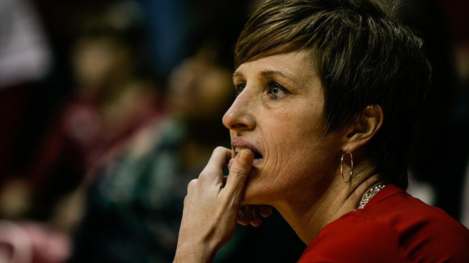 Head coach Teri Moren takes a knee at the edge of the court during the fourth quarter of play. The Hoosiers held on late to beat the Iowa Hawkeyes 79-74 February 4, 2016.